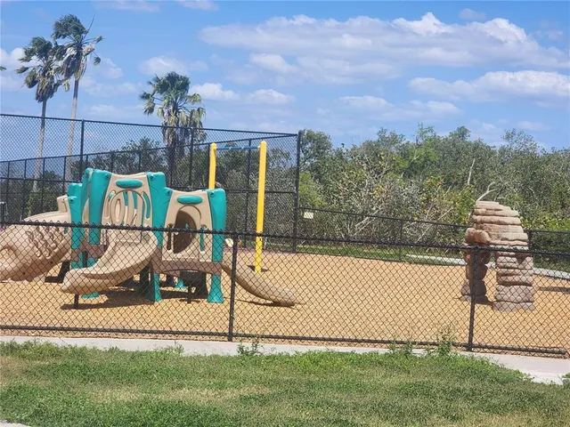 a view of a chair and table in the garden