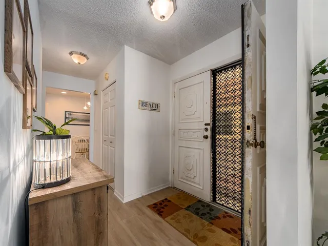 a view of entryway with wooden floor