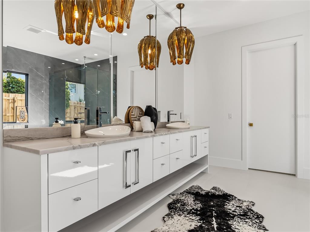 1821 Englewood Road Winter Park, FL 32789 - Photo 15 of 36 a bathroom with a sink and a mirror