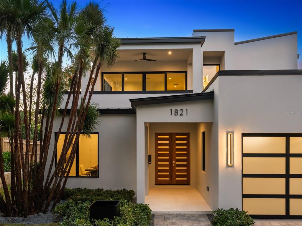 1821 Englewood Road Winter Park, FL 32789 - Photo 2 of 36 a front view of a house with a garage