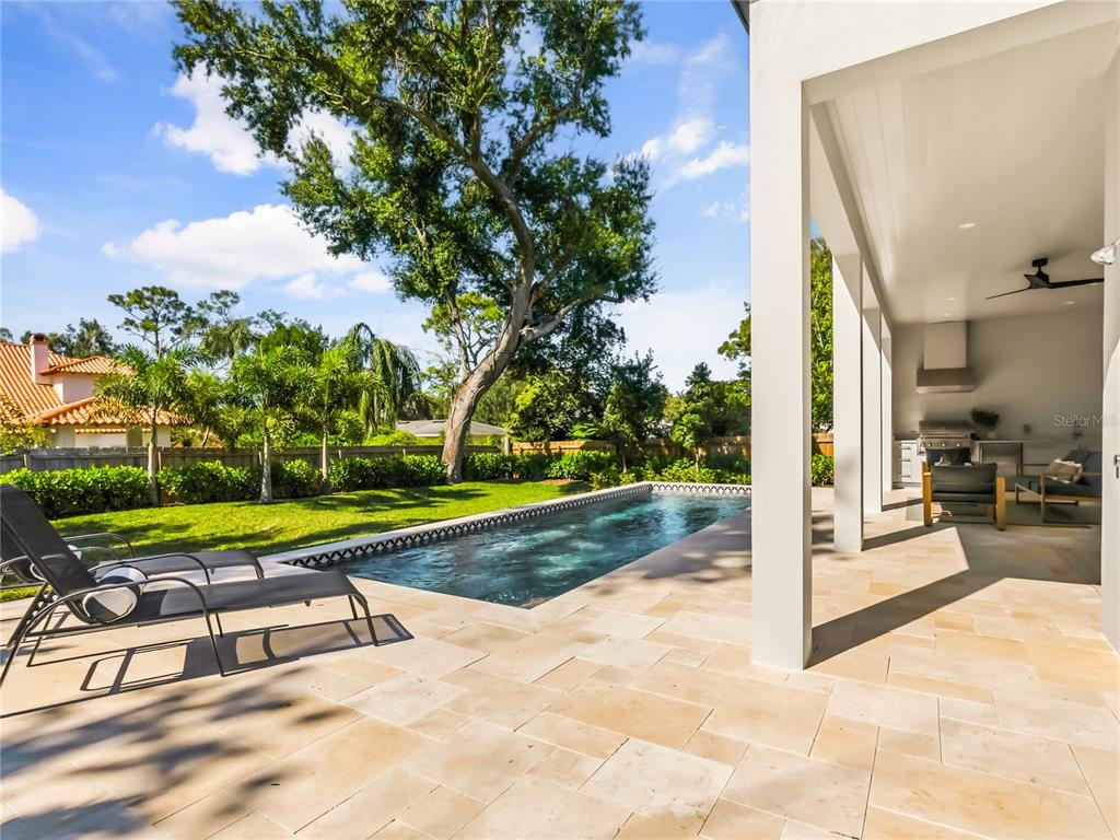 1821 Englewood Road Winter Park, FL 32789 - Photo 32 of 36 a view of a patio with a table and chairs