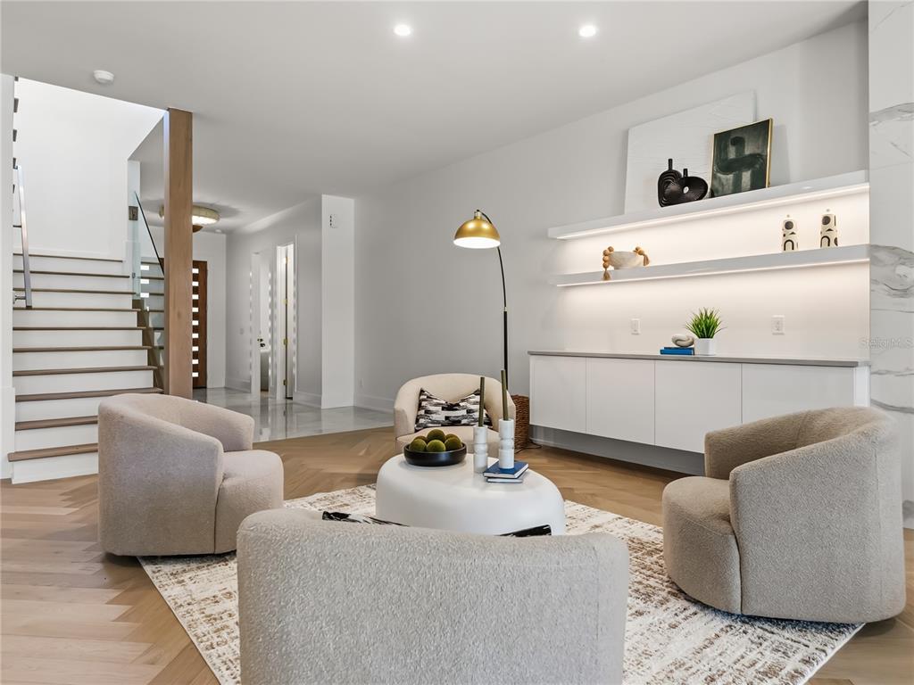 1821 Englewood Road Winter Park, FL 32789 - Photo 7 of 36 a bedroom with furniture and a potted plant