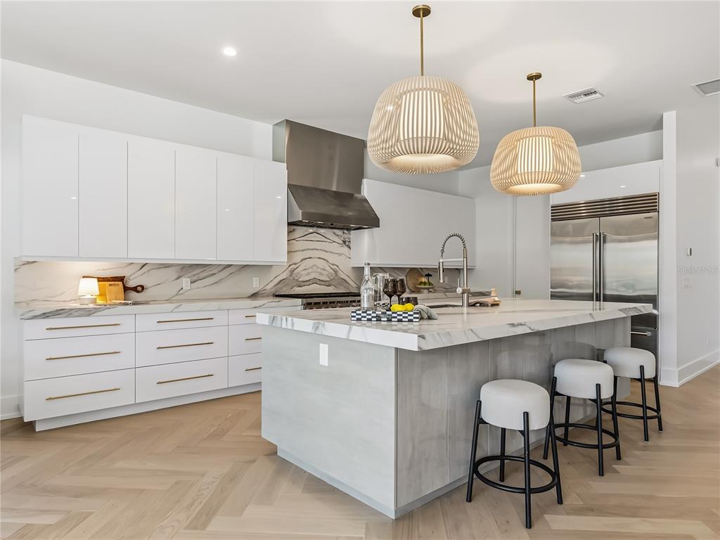 1821 Englewood Road Winter Park, FL 32789 - Photo 10 of 36 a kitchen with sink cabinets and stainless steel appliances