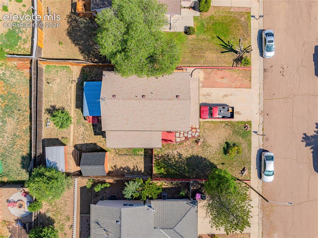 613 Wheat Field Road Fountain, CO 80817 - Photo 25 of 32 an aerial view of a house with a yard and large trees