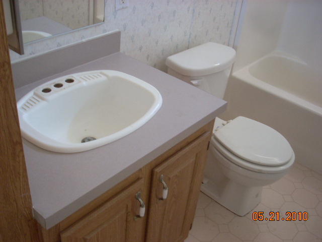 12802 South Zuni Road Buckeye, AZ 85326 - Photo 6 of 9 a bathroom with a toilet and a sink