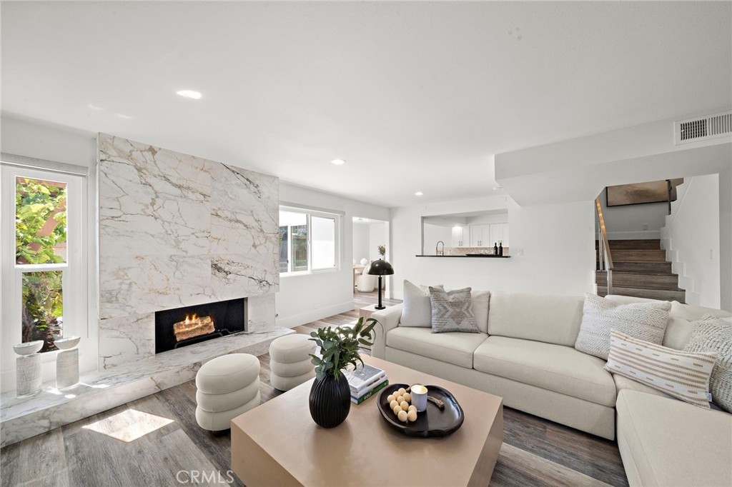 33 Seton Road Irvine, CA 92612 - Photo 7 of 40 Spacious living room featuring a cozy fireplace