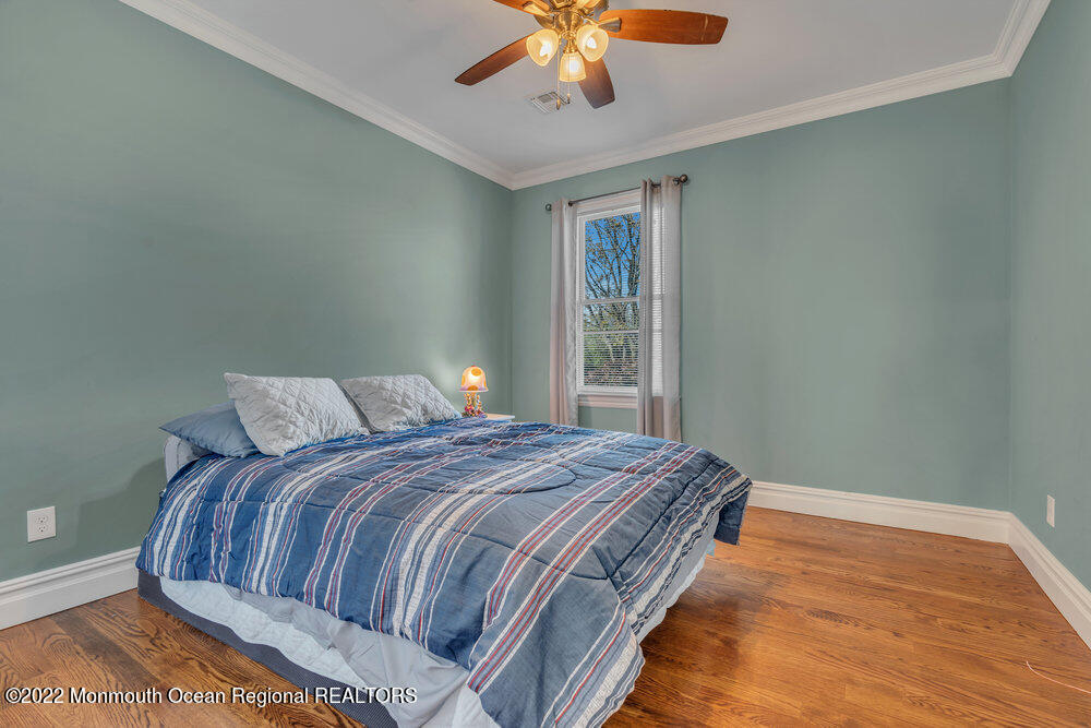 612 Lake Avenue Spring Lake Heights, NJ 07762 - Photo 14 of 22 a bedroom with a bed and window