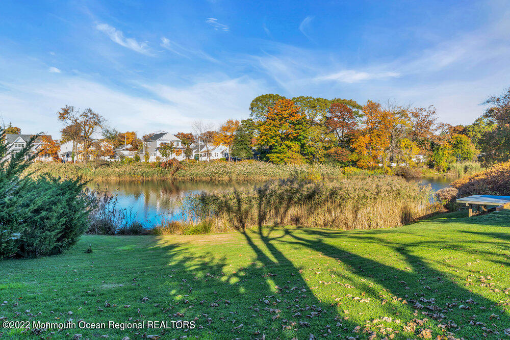 612 Lake Avenue Spring Lake Heights, NJ 07762 - Photo 20 of 22 a view of a lake with a yard