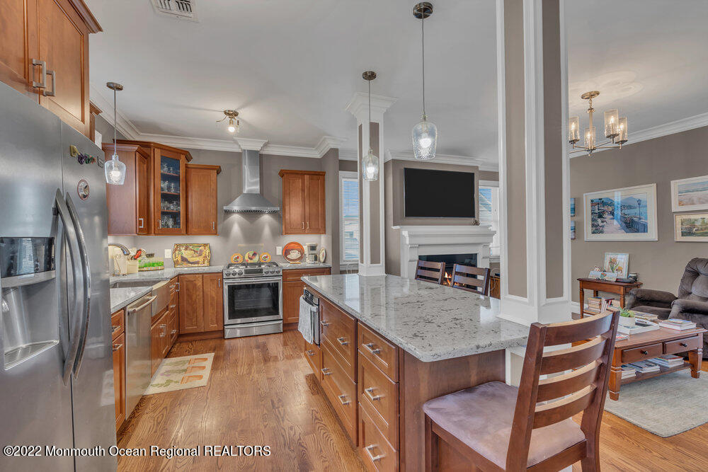 612 Lake Avenue Spring Lake Heights, NJ 07762 - Photo 2 of 22 a large kitchen with a counter space a sink appliances and cabinets