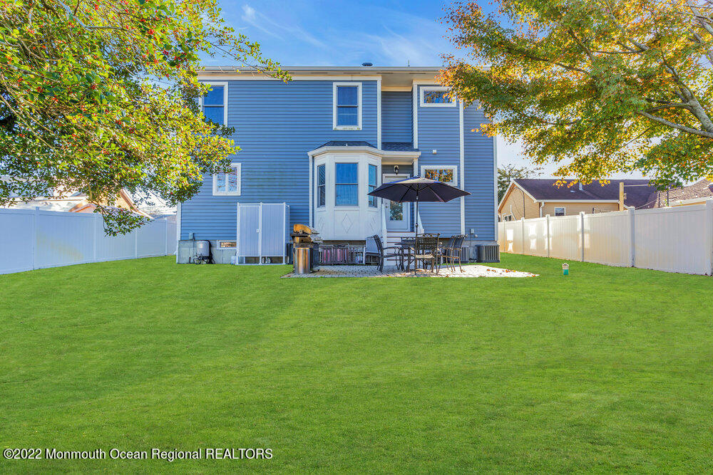 612 Lake Avenue Spring Lake Heights, NJ 07762 - Photo 21 of 22 a view of a house with a backyard
