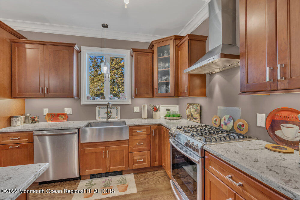 612 Lake Avenue Spring Lake Heights, NJ 07762 - Photo 3 of 22 a kitchen with a sink stove and cabinets