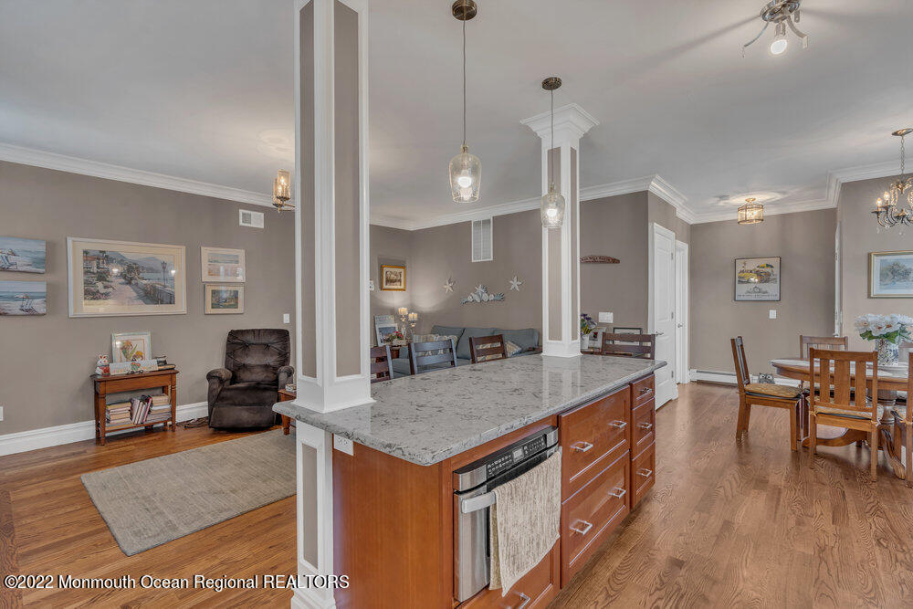 612 Lake Avenue Spring Lake Heights, NJ 07762 - Photo 4 of 22 a dining hall with stainless steel appliances granite countertop furniture and wooden floor
