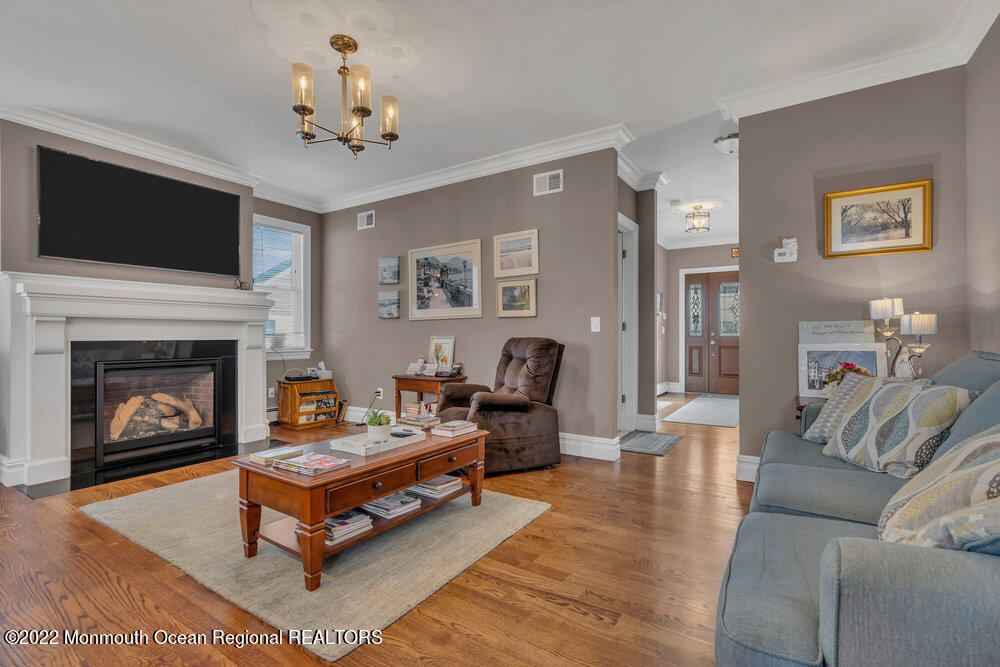 612 Lake Avenue Spring Lake Heights, NJ 07762 - Photo 8 of 22 a living room with furniture and a fireplace