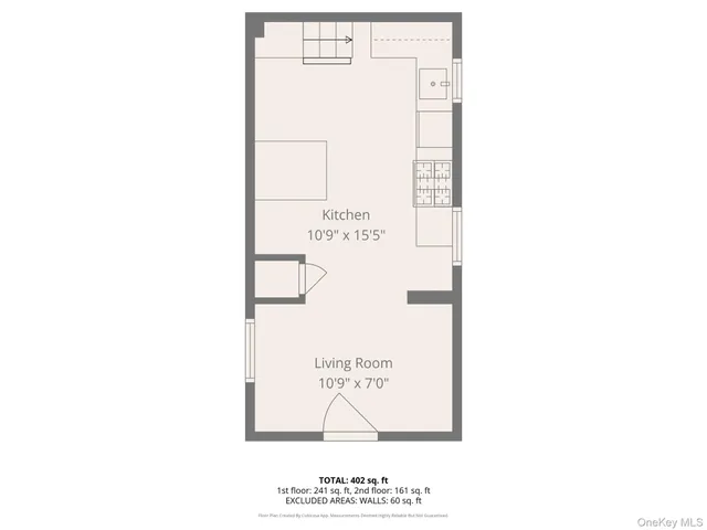 a picture of a bench in front of a wall