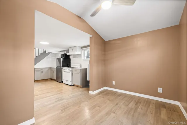 a view of a kitchen with a sink and a stove