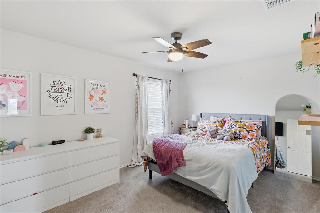 16041 Pious Drive Haslet, TX 76052 - Photo 22 of 36 Bedroom featuring light colored carpet and ceiling fan