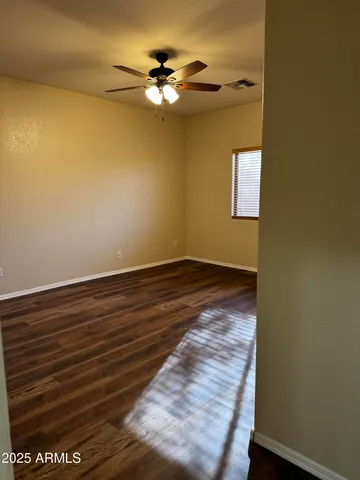 a view of room with fan and wooden floor