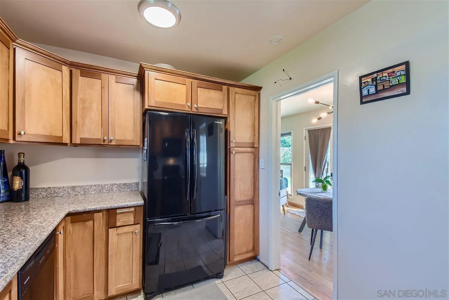 5259 Laurel Street San Diego, CA 92105 - Photo 13 of 32 a kitchen with stainless steel appliances granite countertop a refrigerator and a sink