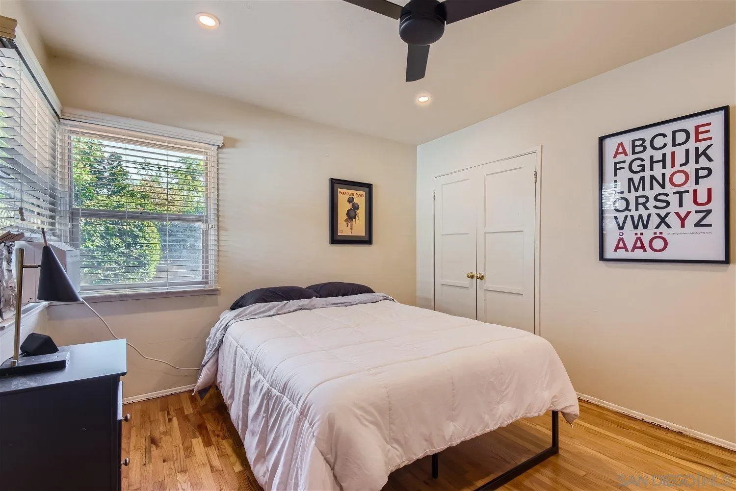 5259 Laurel Street San Diego, CA 92105 - Photo 19 of 32 a bedroom with a bed and a window