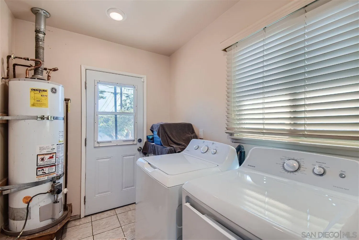 5259 Laurel Street San Diego, CA 92105 - Photo 25 of 32 a bathroom with a sink and a window