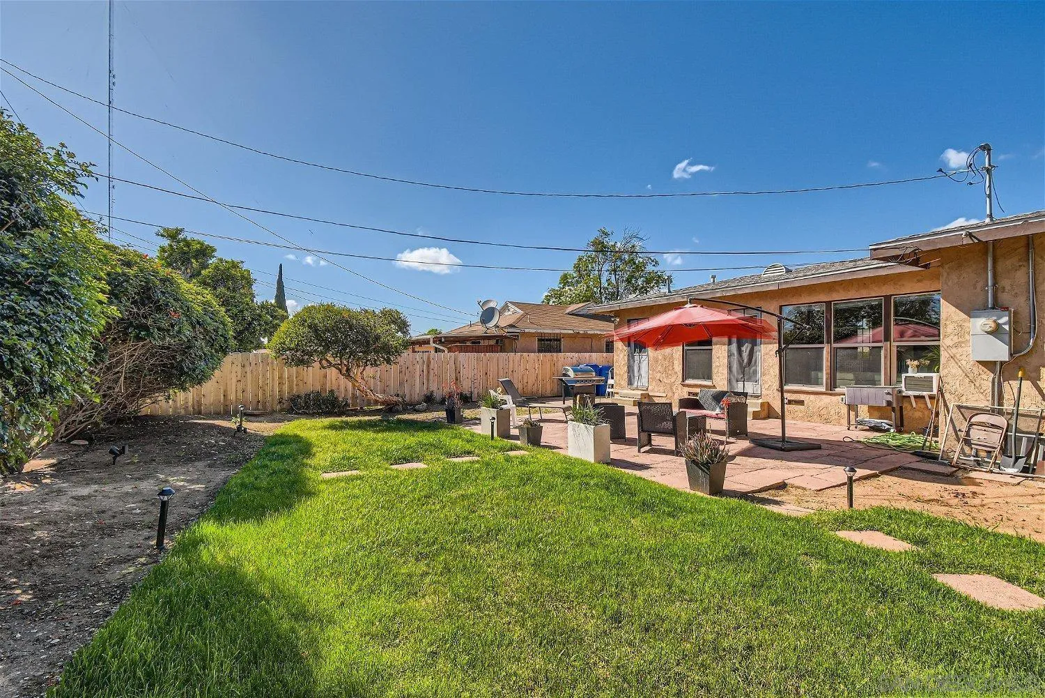 5259 Laurel Street San Diego, CA 92105 - Photo 27 of 32 a view of a patio with table and chairs under an umbrella