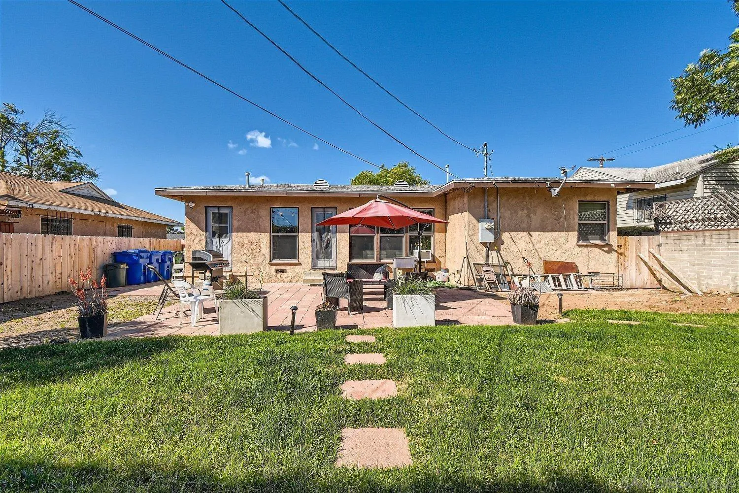 5259 Laurel Street San Diego, CA 92105 - Photo 28 of 32 a front view of a house with garden and sitting area