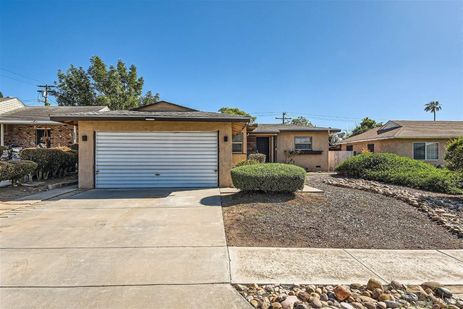 5259 Laurel Street San Diego, CA 92105 - Photo 32 of 32 a view of a house with a yard and potted plants