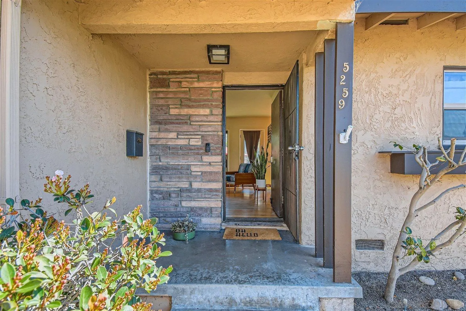 5259 Laurel Street San Diego, CA 92105 - Photo 4 of 32 a view of front door of house and entertaining space