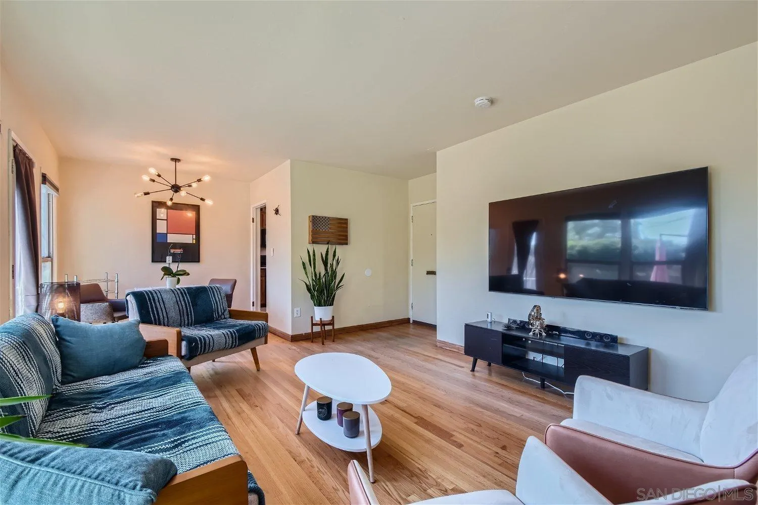 5259 Laurel Street San Diego, CA 92105 - Photo 6 of 32 a living room with furniture and a flat screen tv
