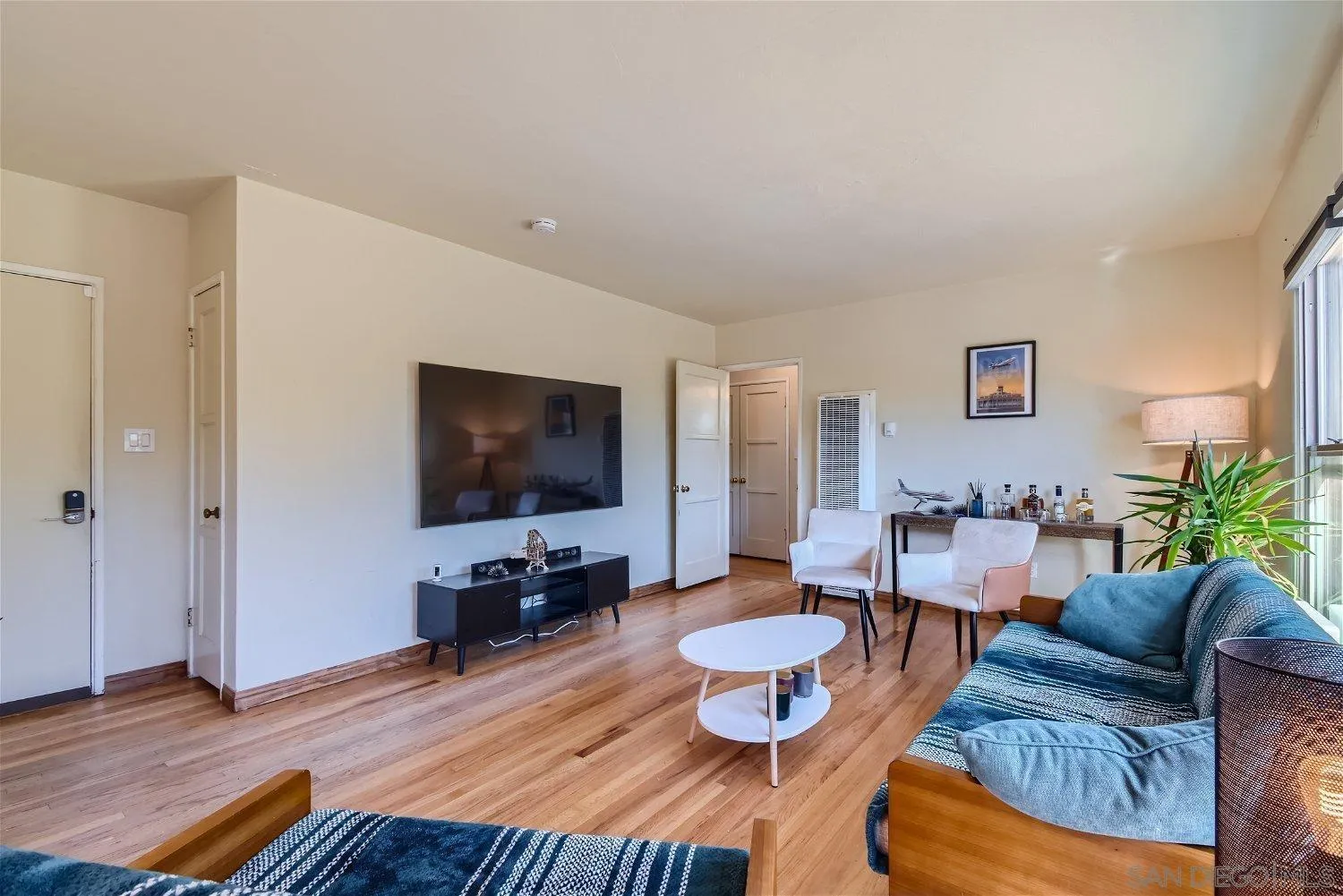 5259 Laurel Street San Diego, CA 92105 - Photo 8 of 32 a living room with furniture and a flat screen tv
