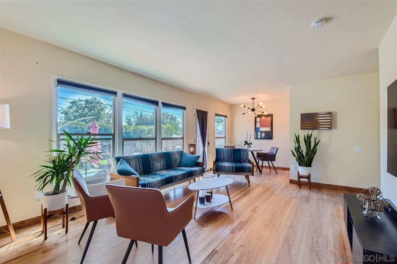 5259 Laurel Street San Diego, CA 92105 - Photo 9 of 32 a living room with furniture and wooden floor