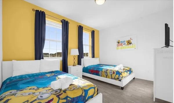 a bedroom with a bed and a couch