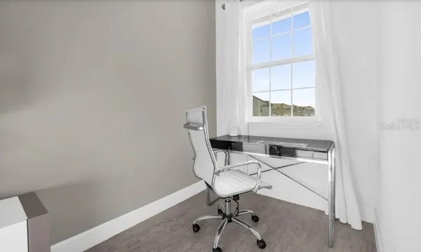 a view of a workspace with furniture