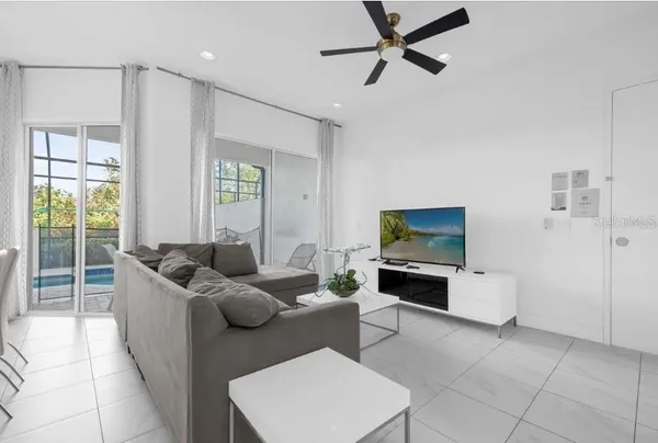 a living room with furniture and a flat screen tv