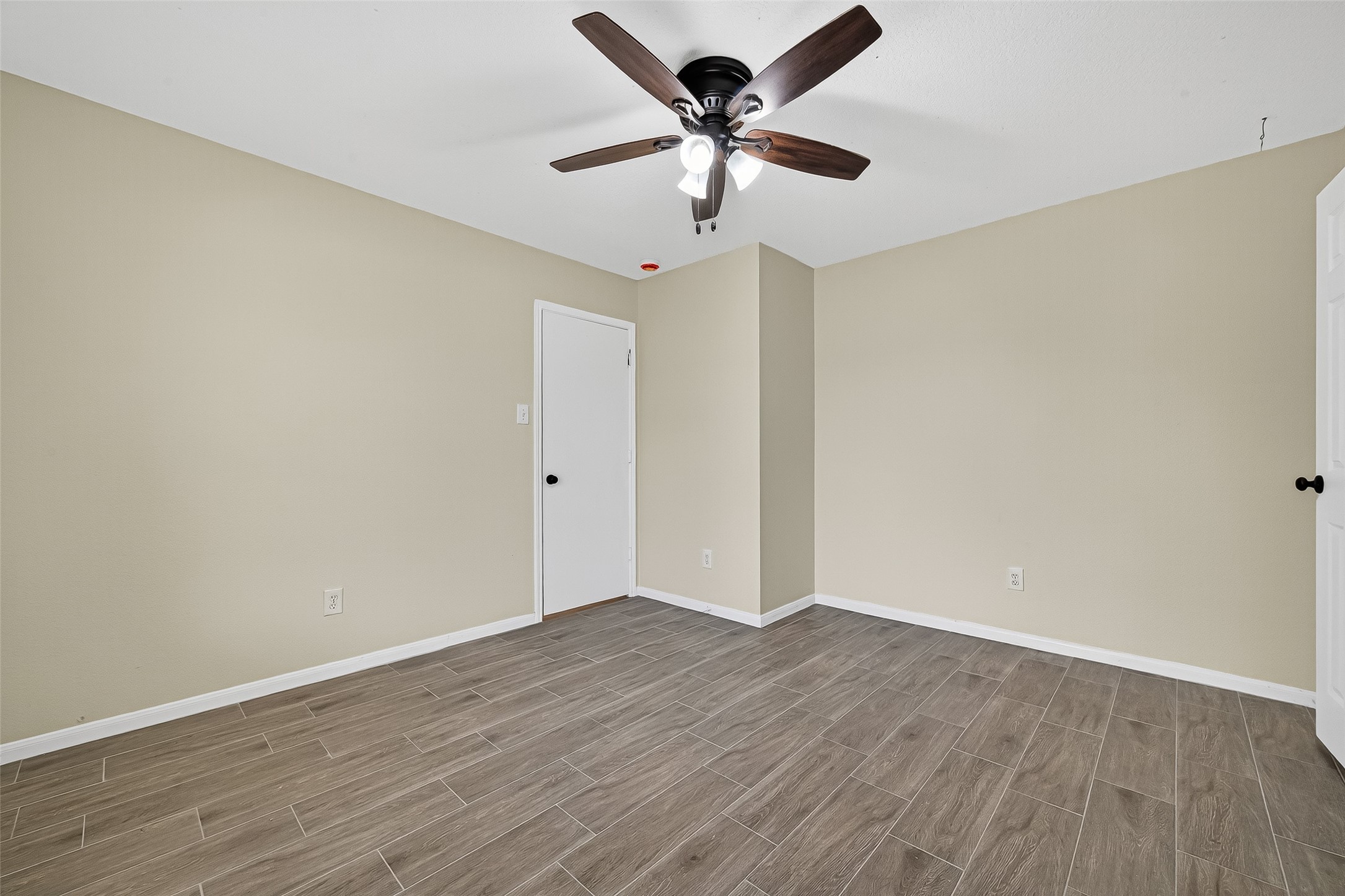 18759 Holly Way Houston, TX 77084 - Photo 13 of 46 a view of an empty room with wooden floor