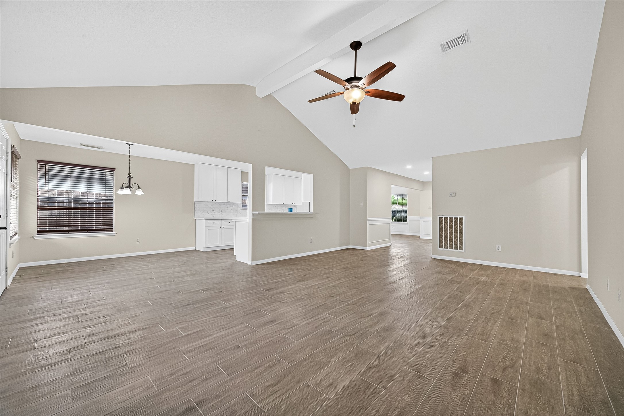 18759 Holly Way Houston, TX 77084 - Photo 16 of 46 a view of empty room with wooden floor and window