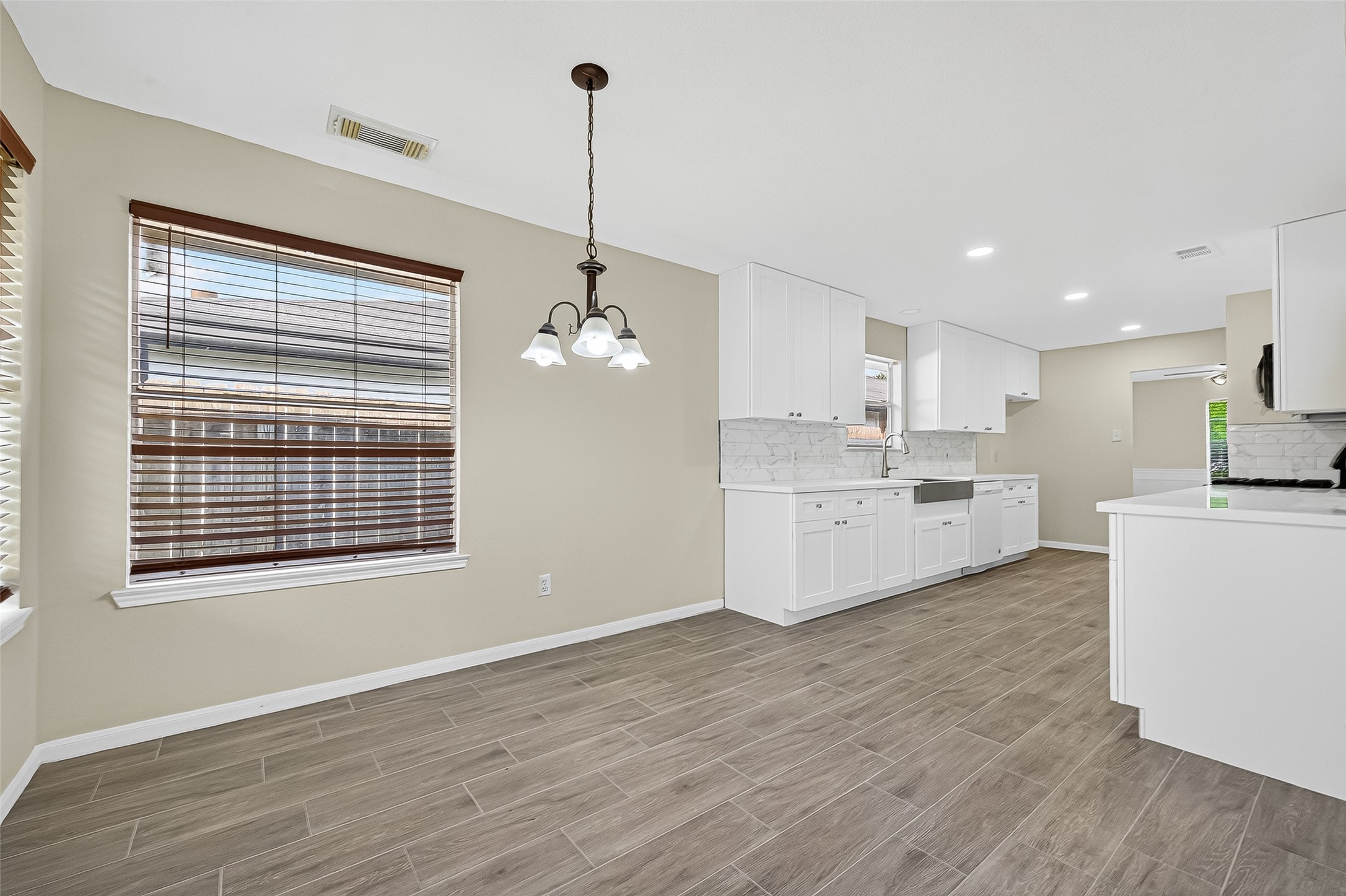 18759 Holly Way Houston, TX 77084 - Photo 18 of 46 a view of a kitchen with center island and stainless steel appliances