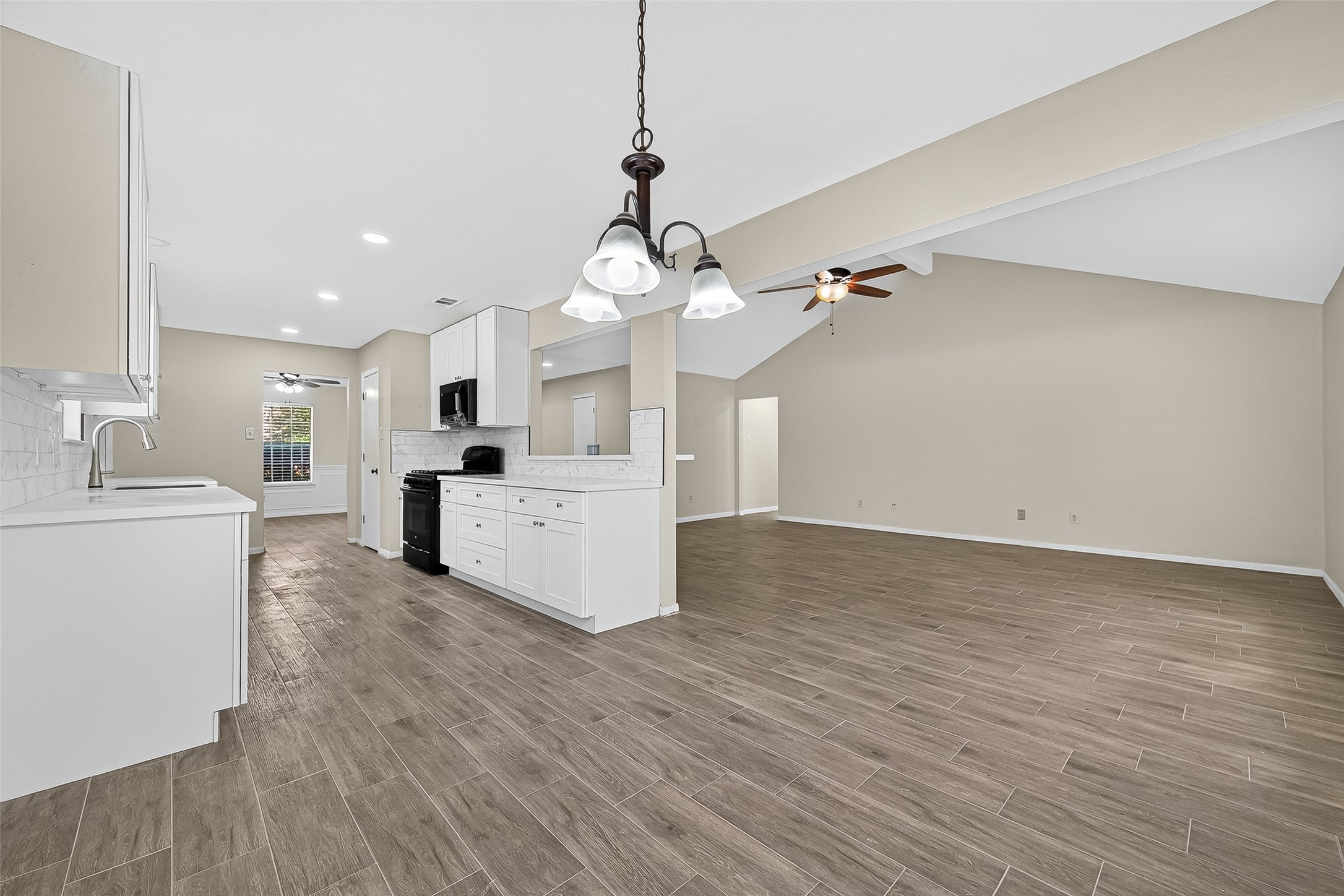 18759 Holly Way Houston, TX 77084 - Photo 21 of 46 a view of a kitchen with sink and cabinet with wooden floor