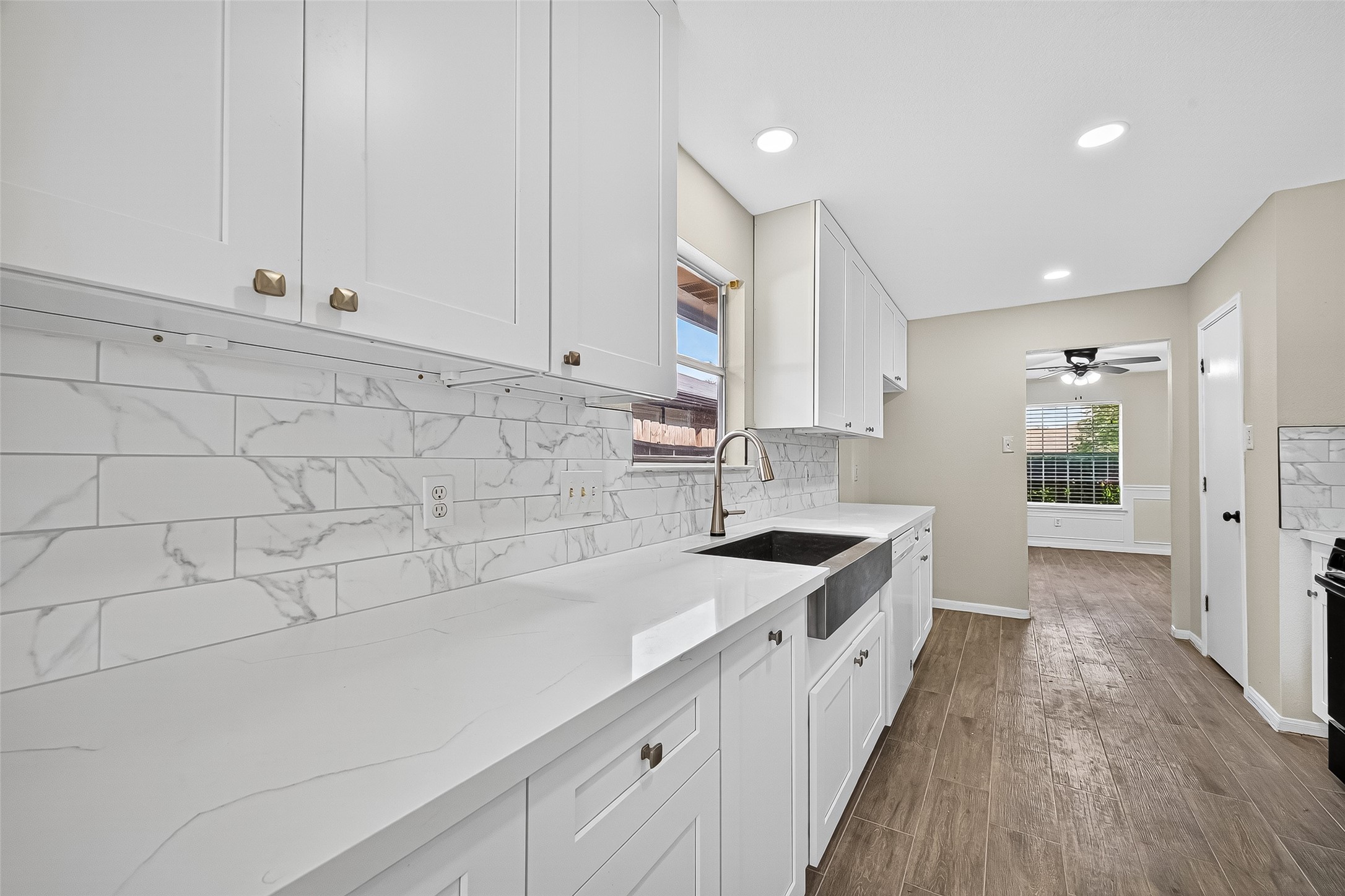 18759 Holly Way Houston, TX 77084 - Photo 24 of 46 a kitchen with a sink and cabinets