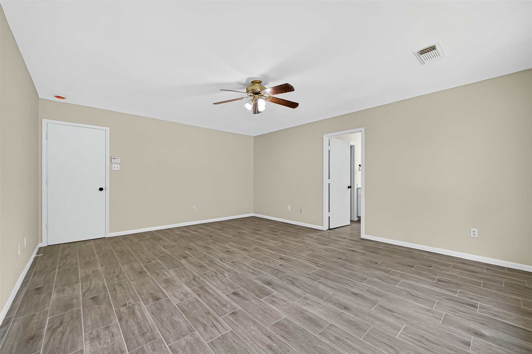 18759 Holly Way Houston, TX 77084 - Photo 30 of 46 wooden floor in an empty room with a window