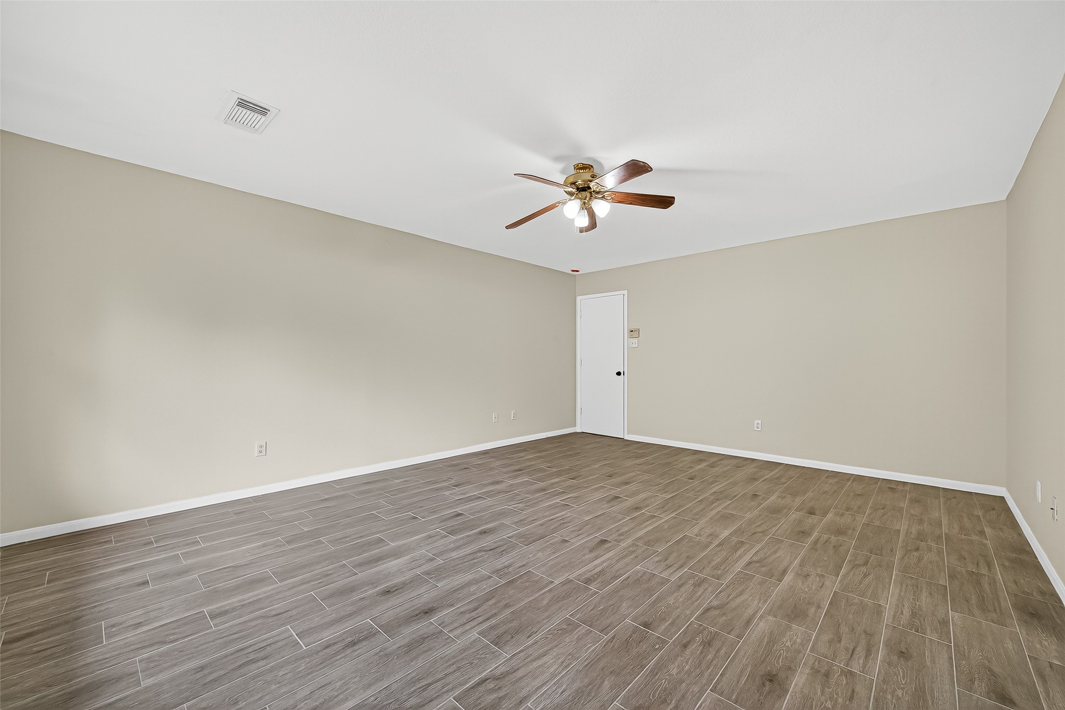 18759 Holly Way Houston, TX 77084 - Photo 31 of 46 a view of an empty room with wooden floor