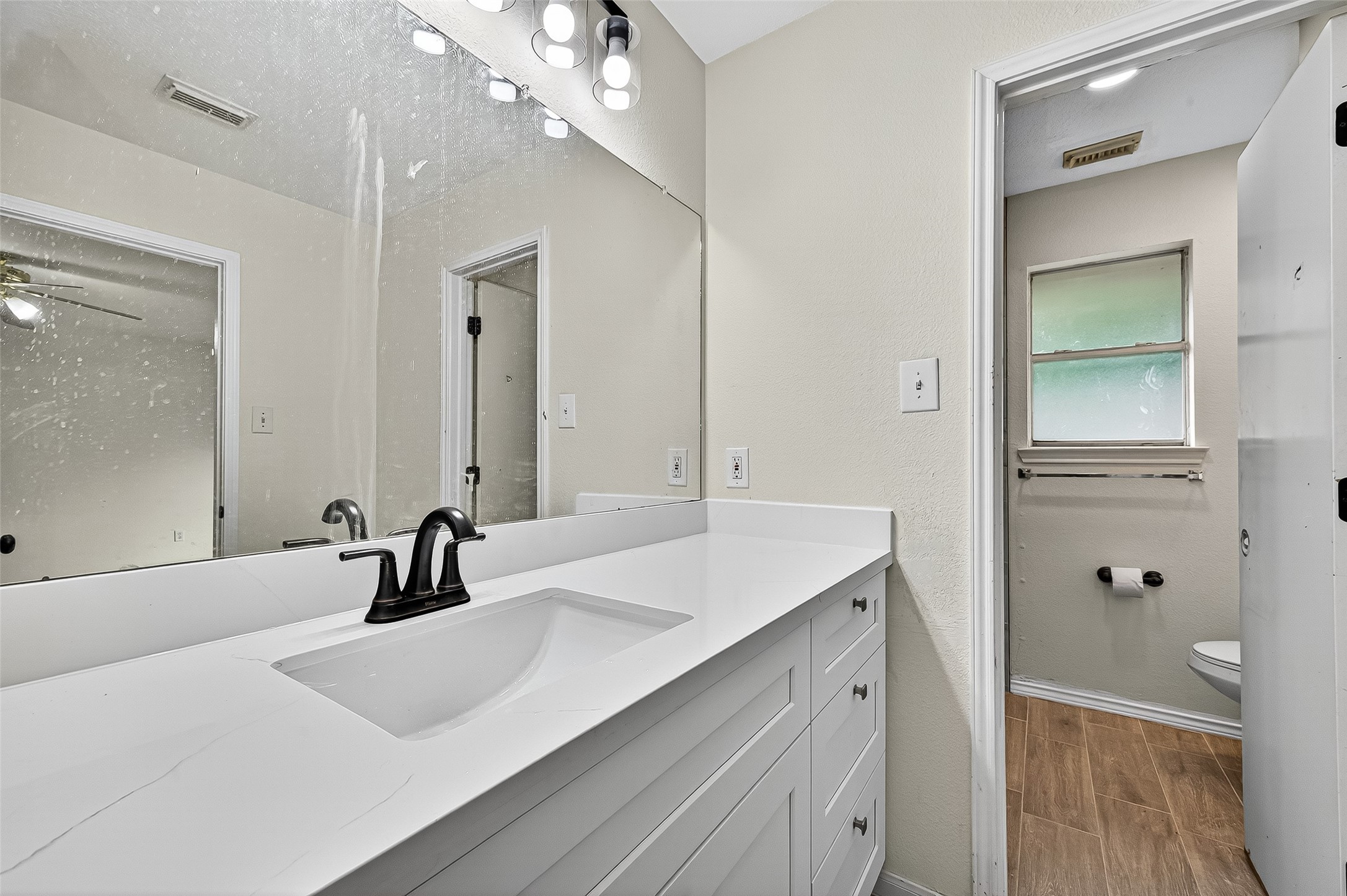 18759 Holly Way Houston, TX 77084 - Photo 33 of 46 a bathroom with a double vanity sink mirror and