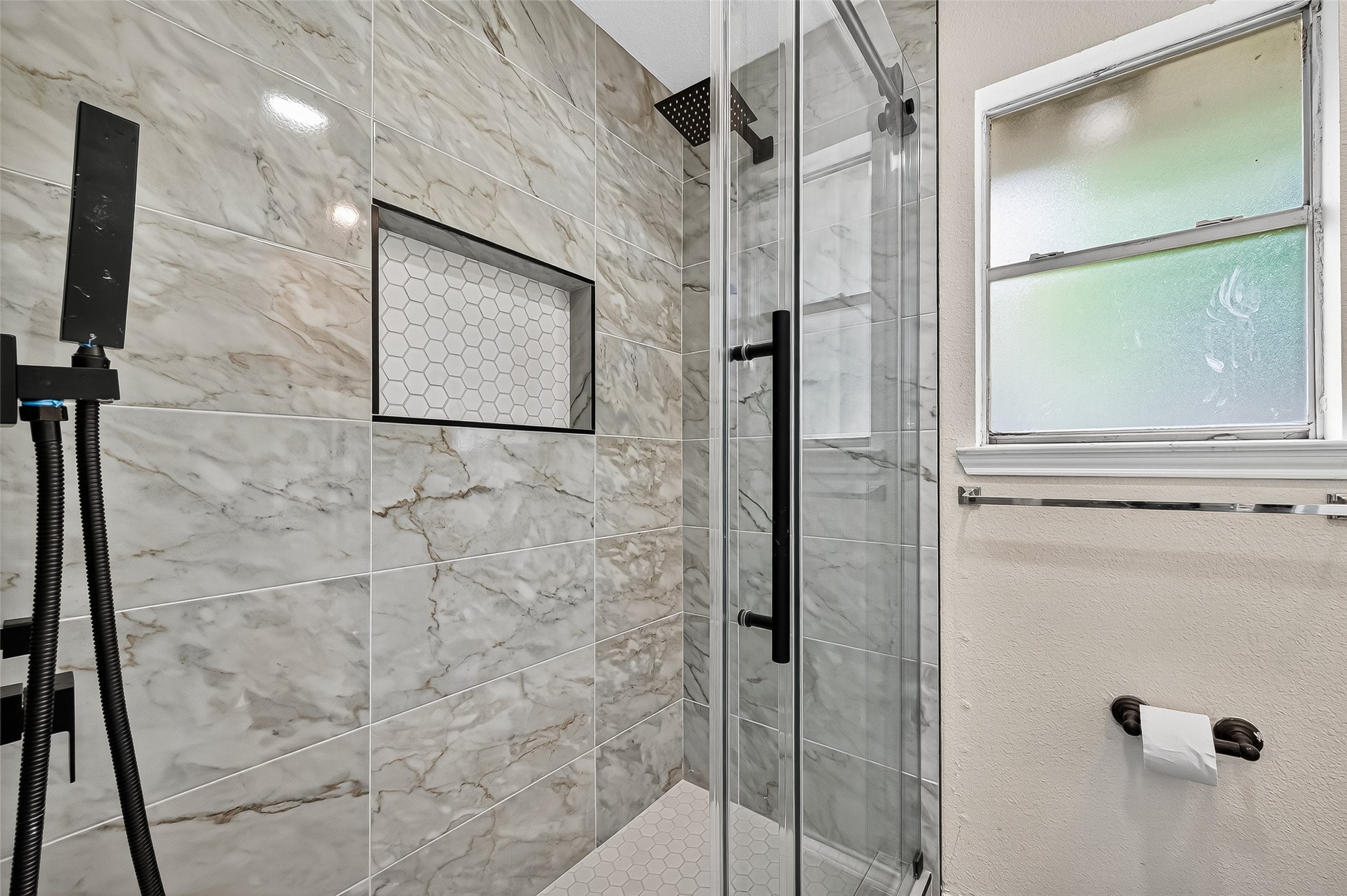 18759 Holly Way Houston, TX 77084 - Photo 34 of 46 a bathroom with a shower and a glass door