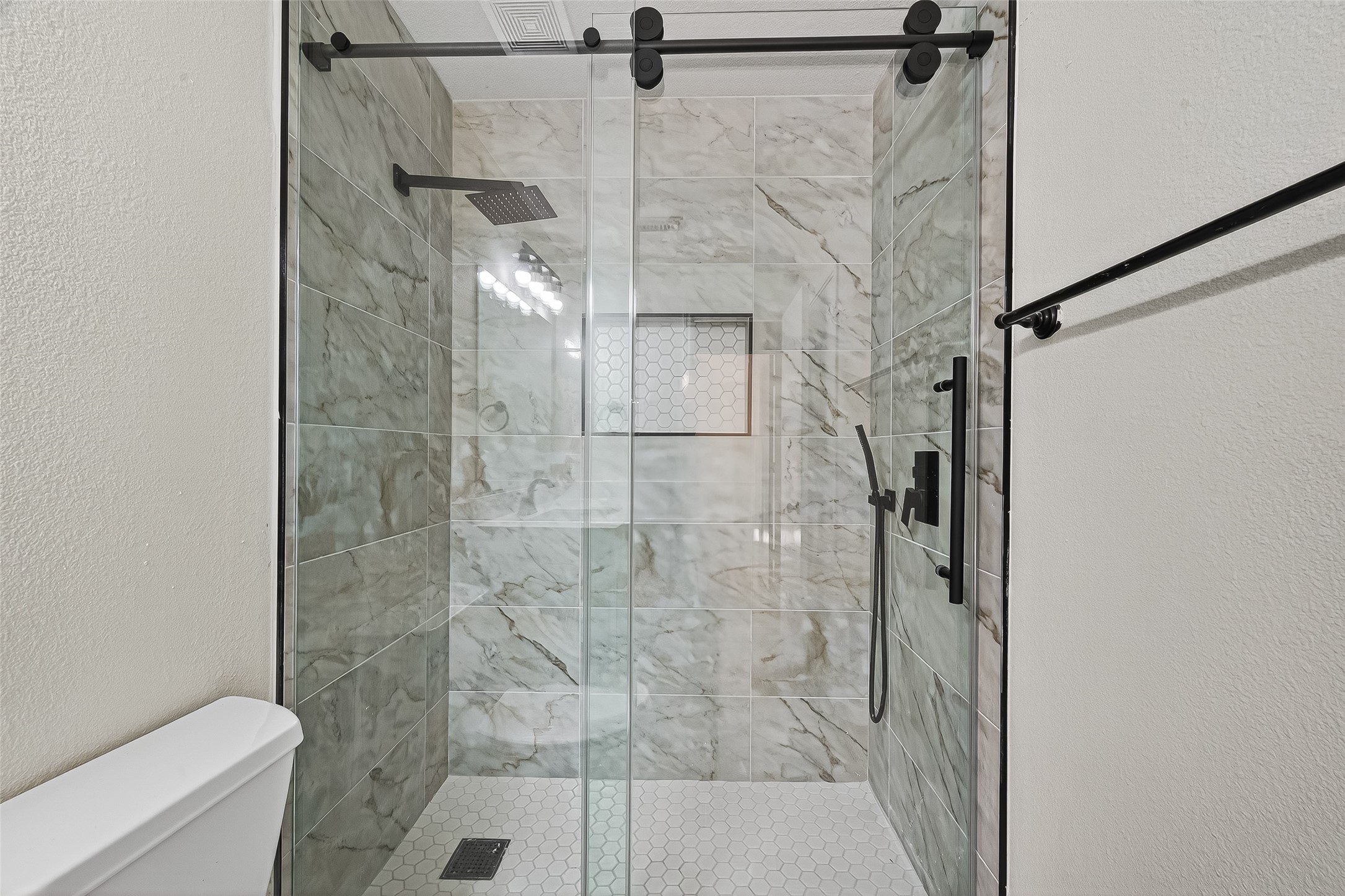 18759 Holly Way Houston, TX 77084 - Photo 39 of 46 a bathroom with a shower and toilet