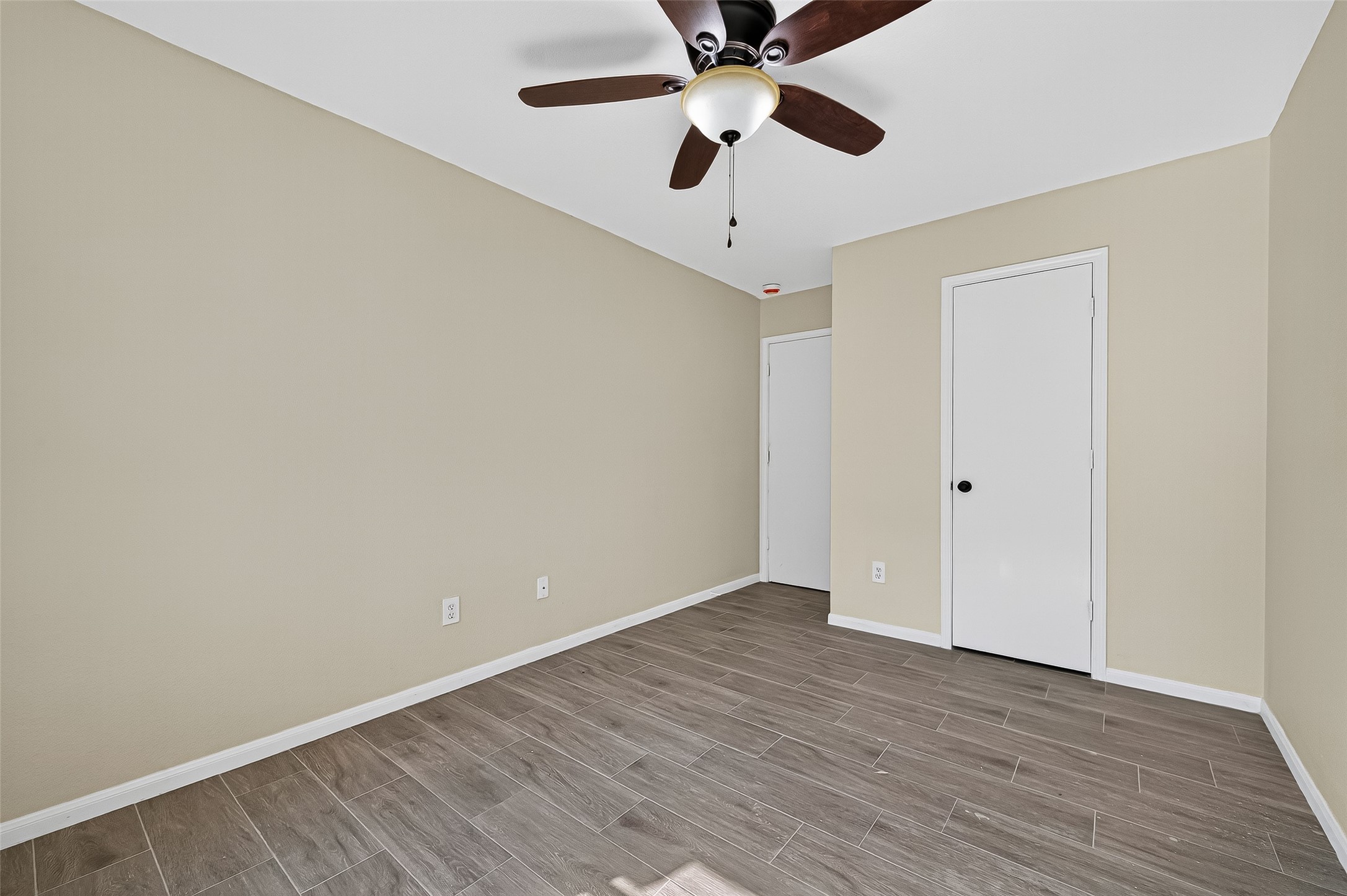 18759 Holly Way Houston, TX 77084 - Photo 42 of 46 wooden floor in an empty room