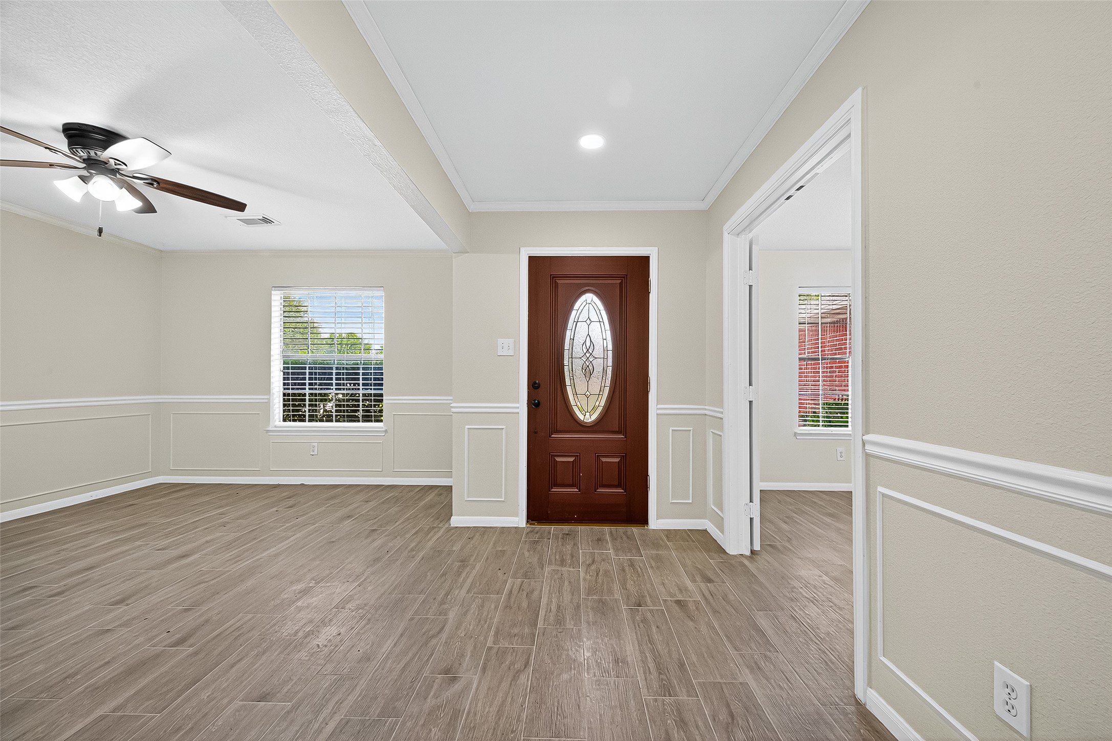 18759 Holly Way Houston, TX 77084 - Photo 5 of 46 wooden floor in an empty room with a window