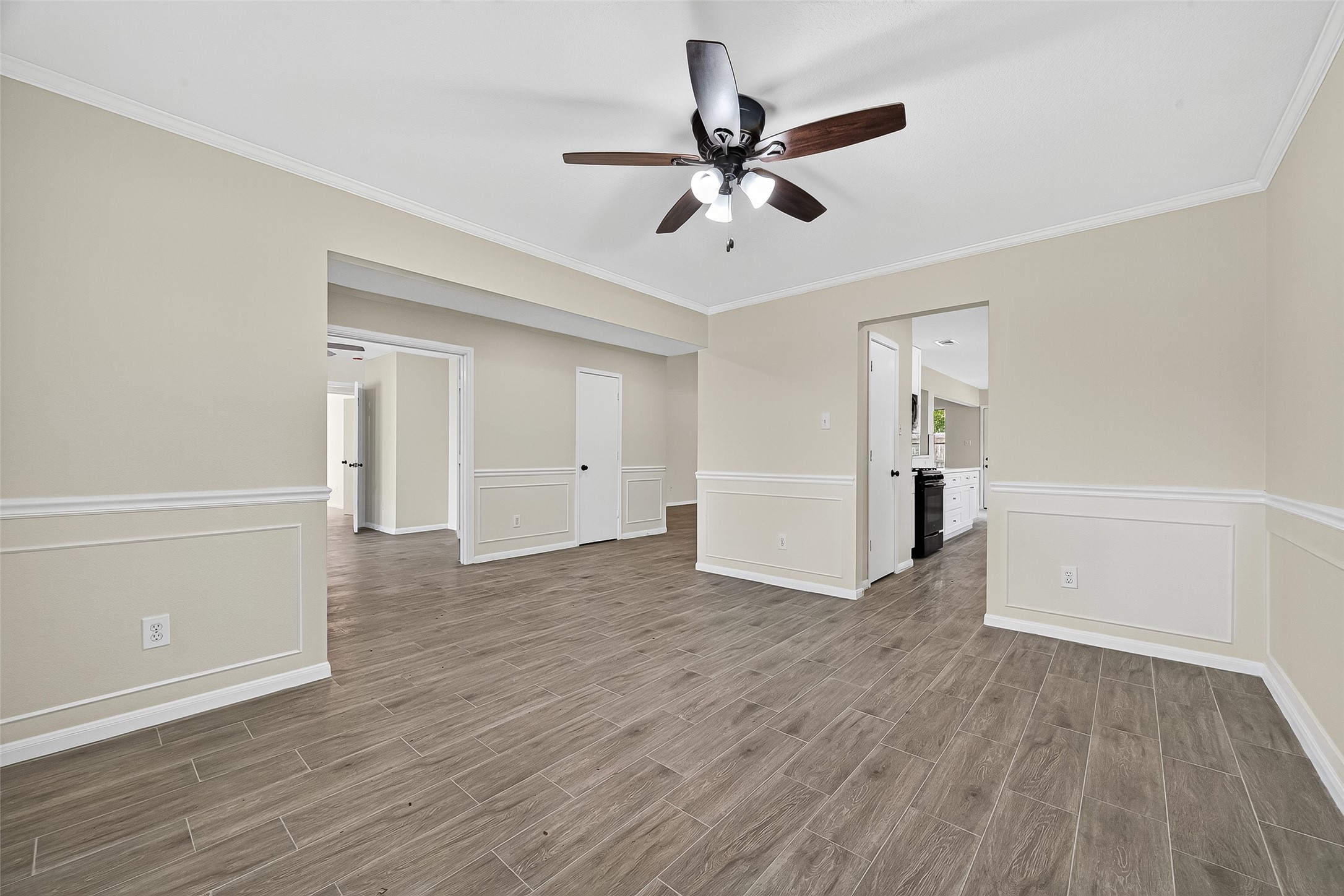 18759 Holly Way Houston, TX 77084 - Photo 9 of 46 a view of a livingroom with wooden floor and a ceiling fan