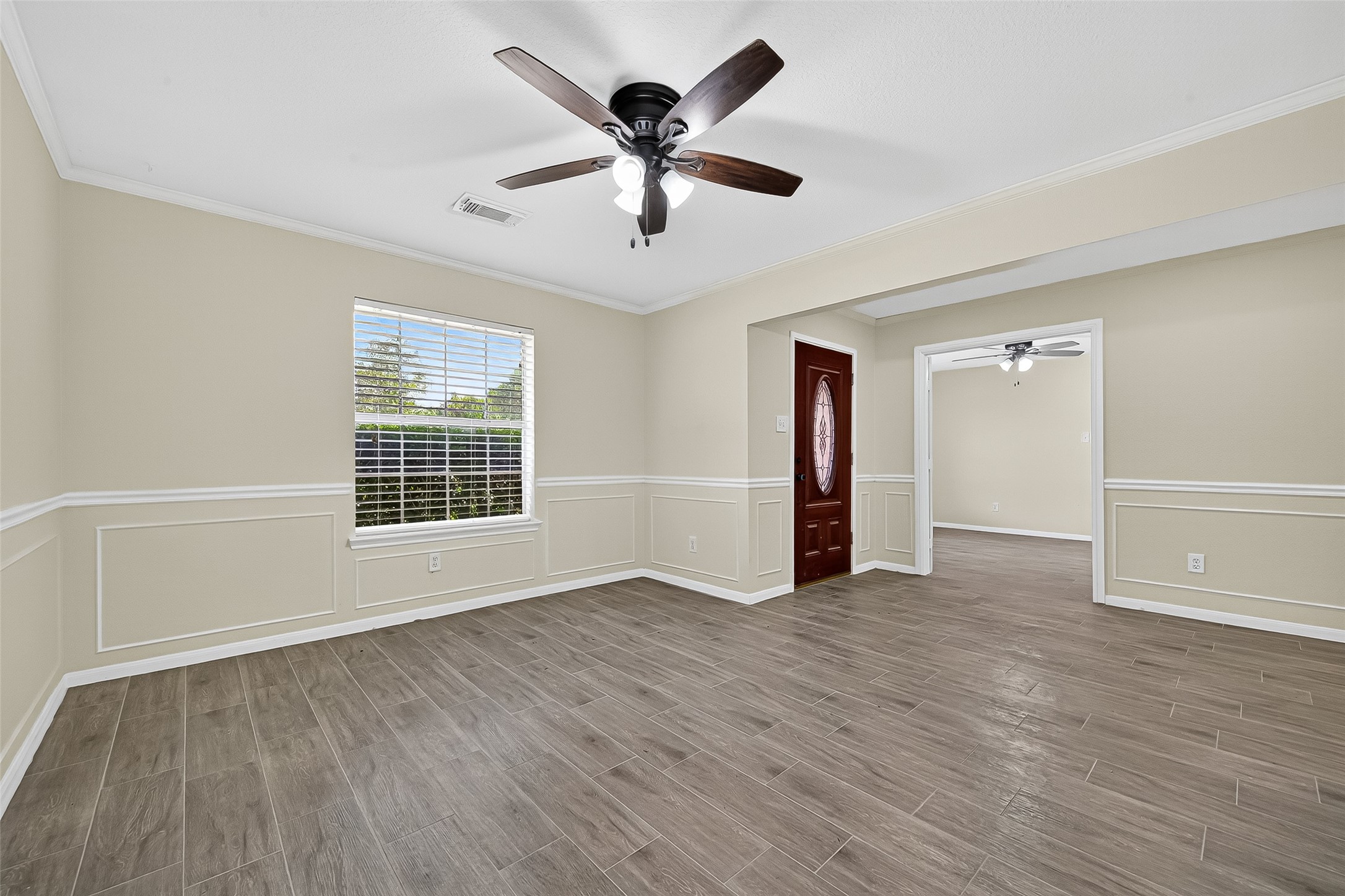 18759 Holly Way Houston, TX 77084 - Photo 10 of 46 wooden floor in an empty room with a window