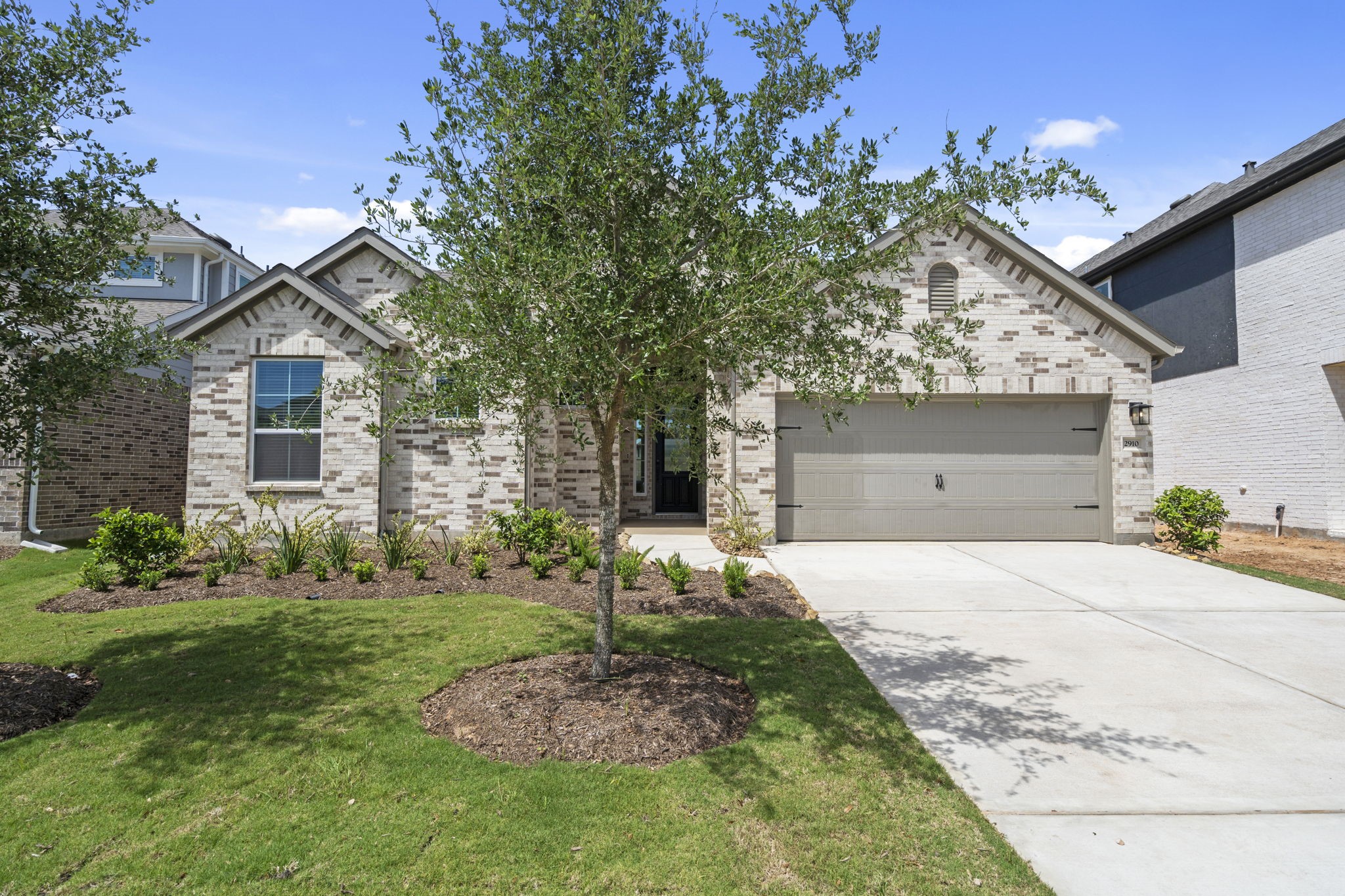 2910 Peach Vly Road Fulshear, TX 77423 - Photo 3 of 35 a front view of a house with a yard and garage