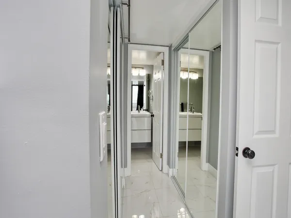 a view of a bathroom from a hallway